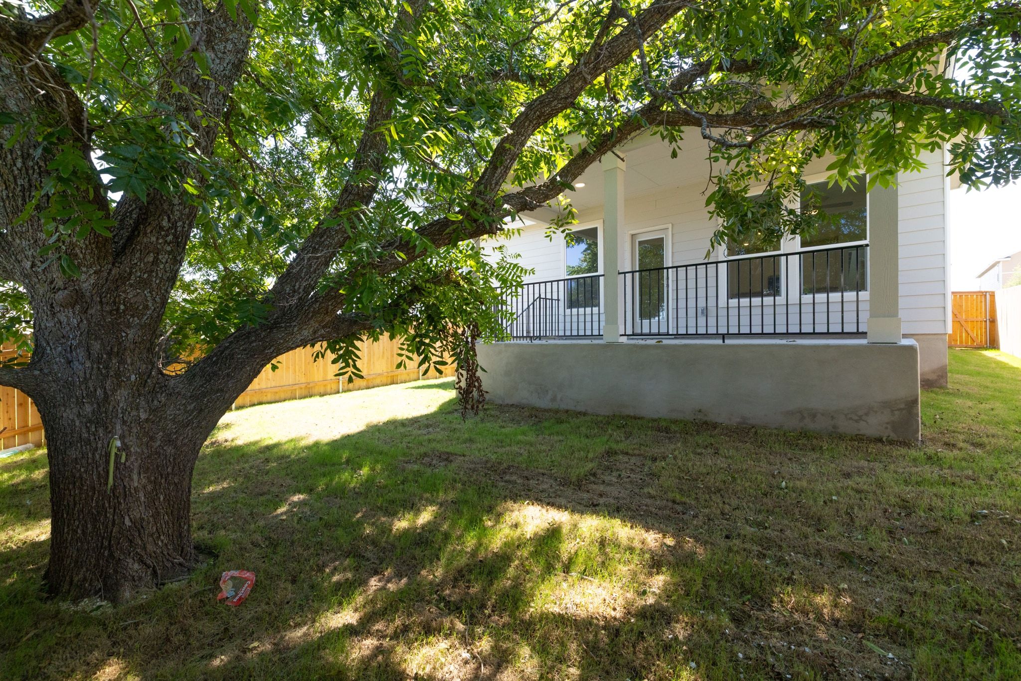 248 Feathers Street Jarrell, TX 76537 - Photo 30 of 32 a view of a house with a tree in a yard