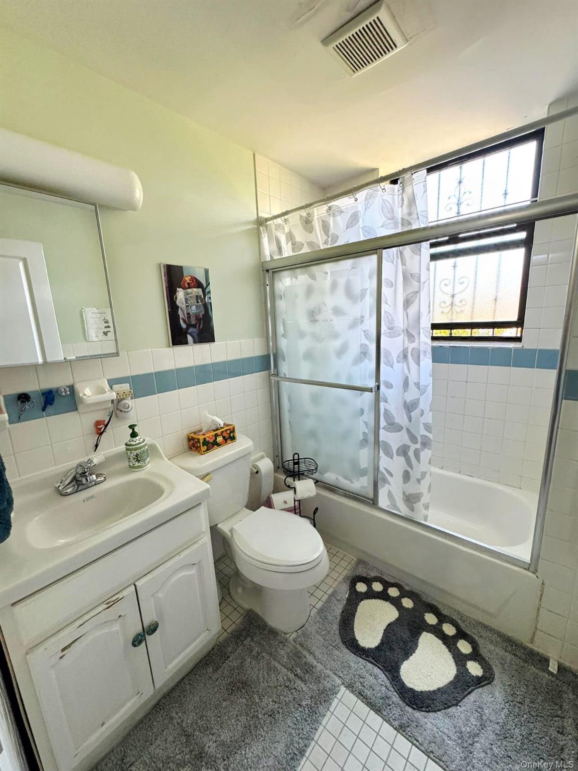 1231 Putnam Avenue Brooklyn, NY 11221 - Photo 14 of 20 a bathroom with a granite countertop toilet sink and mirror