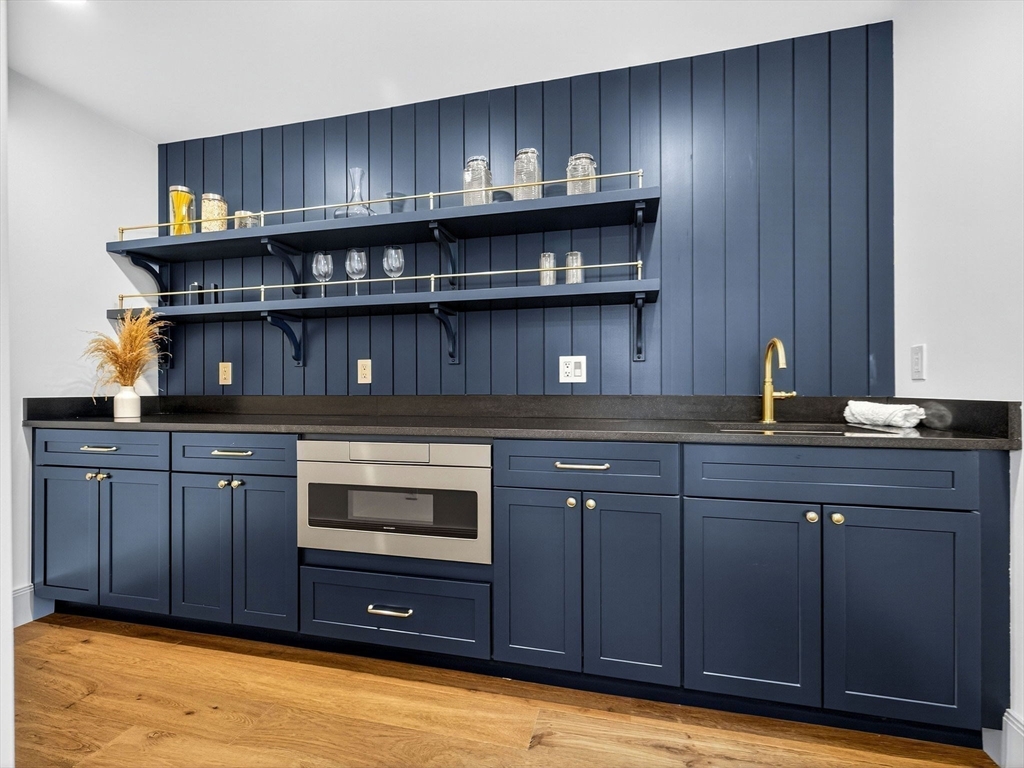 9 Norfolk Road Winchester, MA 01890 - Photo 16 of 42 a kitchen with a sink and cabinets