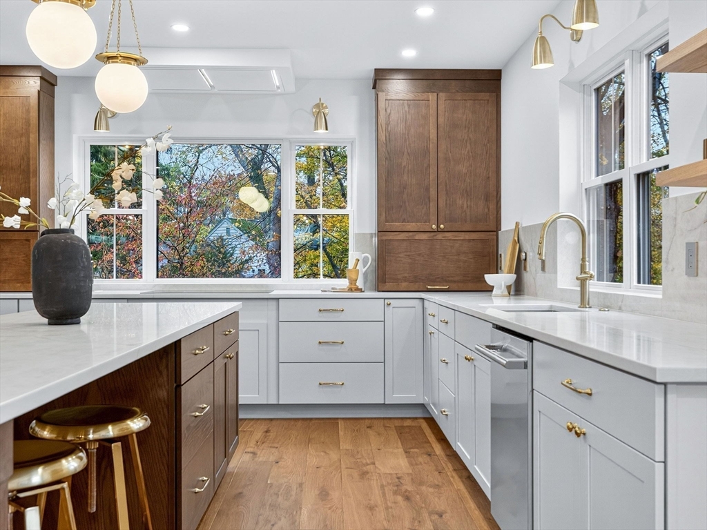 9 Norfolk Road Winchester, MA 01890 - Photo 17 of 42 a kitchen with a sink stove and cabinets