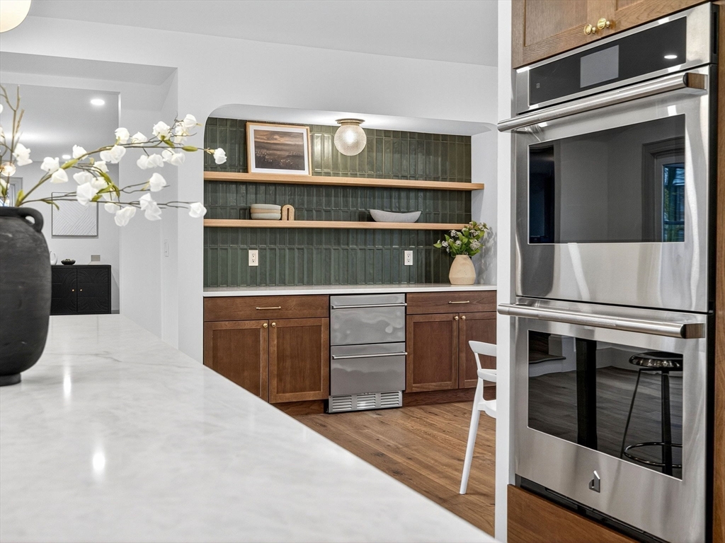 9 Norfolk Road Winchester, MA 01890 - Photo 19 of 42 a kitchen with a stove and cabinets