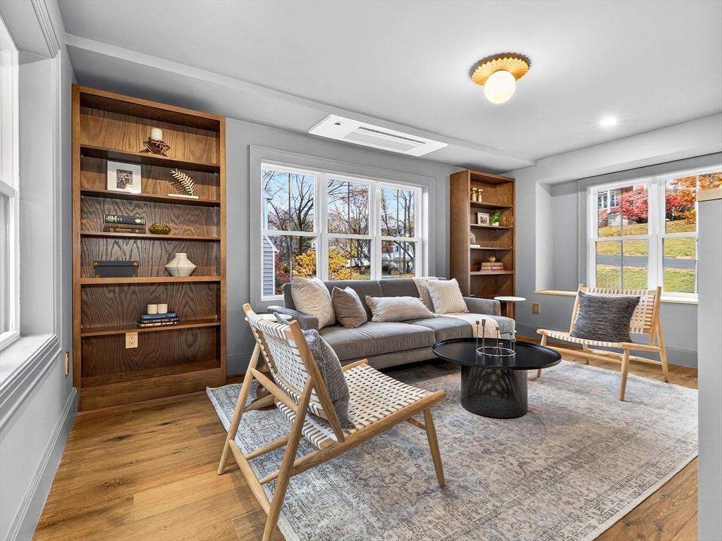 9 Norfolk Road Winchester, MA 01890 - Photo 21 of 42 a living room with furniture a rug and white walls