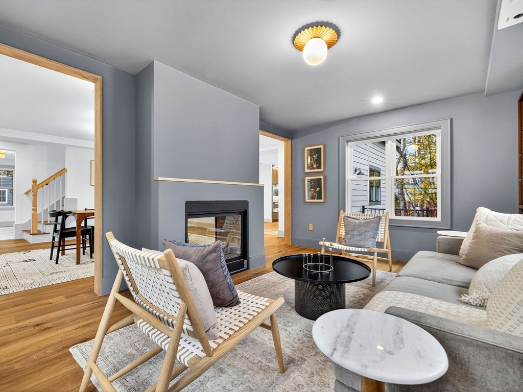 9 Norfolk Road Winchester, MA 01890 - Photo 22 of 42 a living room with furniture a fireplace and a large window