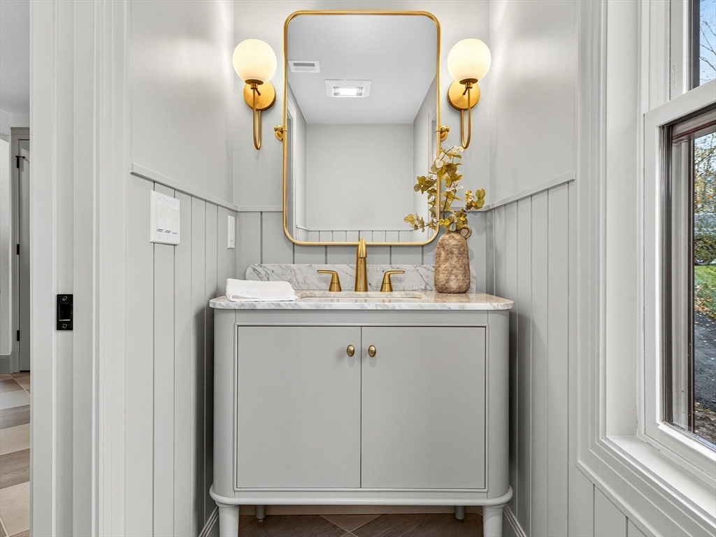 9 Norfolk Road Winchester, MA 01890 - Photo 23 of 42 a bathroom with a sink and a mirror