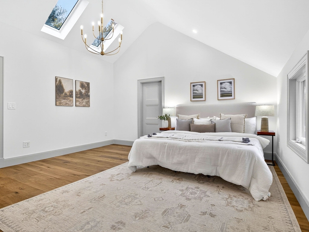 9 Norfolk Road Winchester, MA 01890 - Photo 24 of 42 a spacious bedroom with a bed and a window