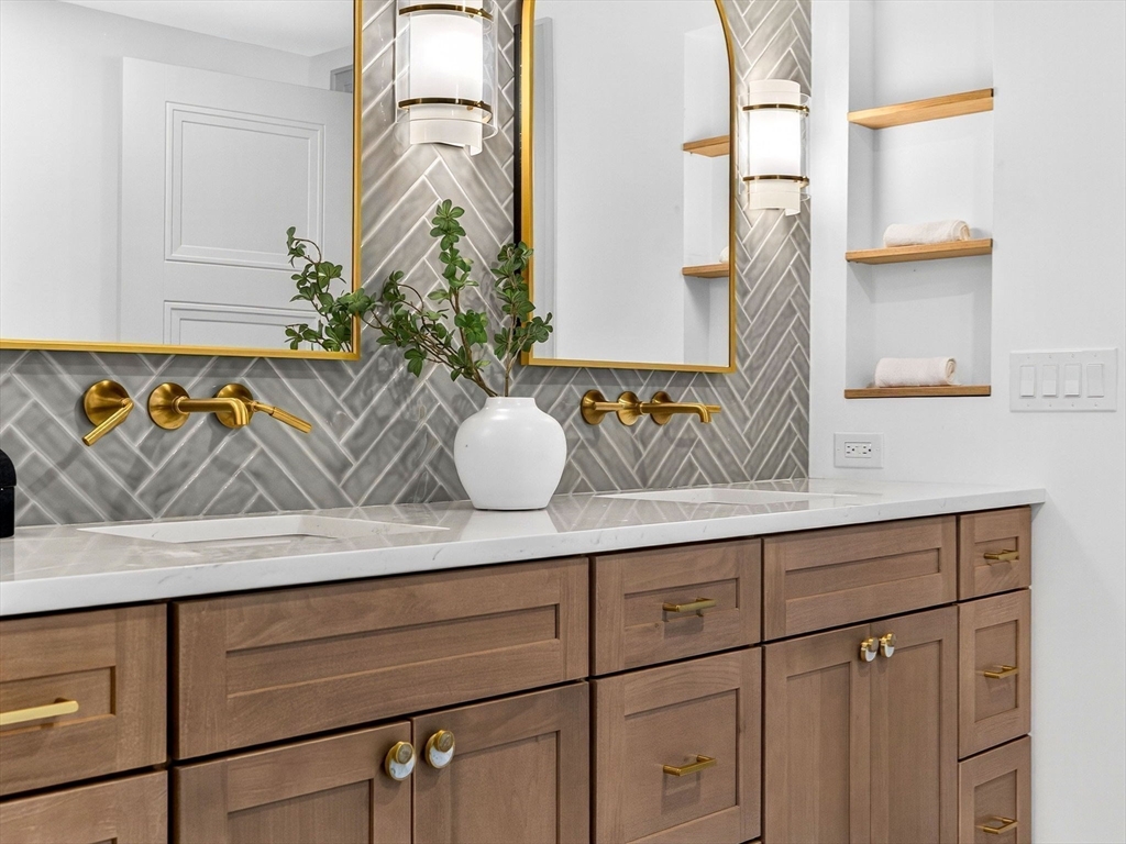 9 Norfolk Road Winchester, MA 01890 - Photo 26 of 42 a bathroom with a sink and a mirror