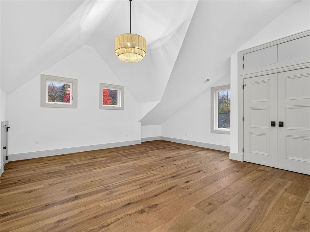 9 Norfolk Road Winchester, MA 01890 - Photo 30 of 42 a view of an empty room with wooden floor and window