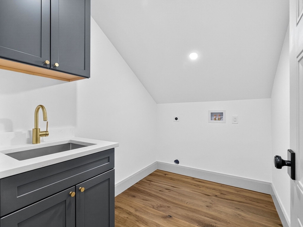 9 Norfolk Road Winchester, MA 01890 - Photo 31 of 42 a kitchen with a sink and wooden floor