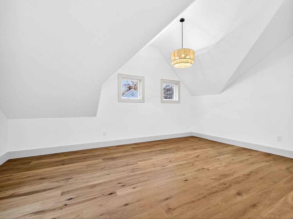9 Norfolk Road Winchester, MA 01890 - Photo 32 of 42 a view of an empty room with wooden floor and window
