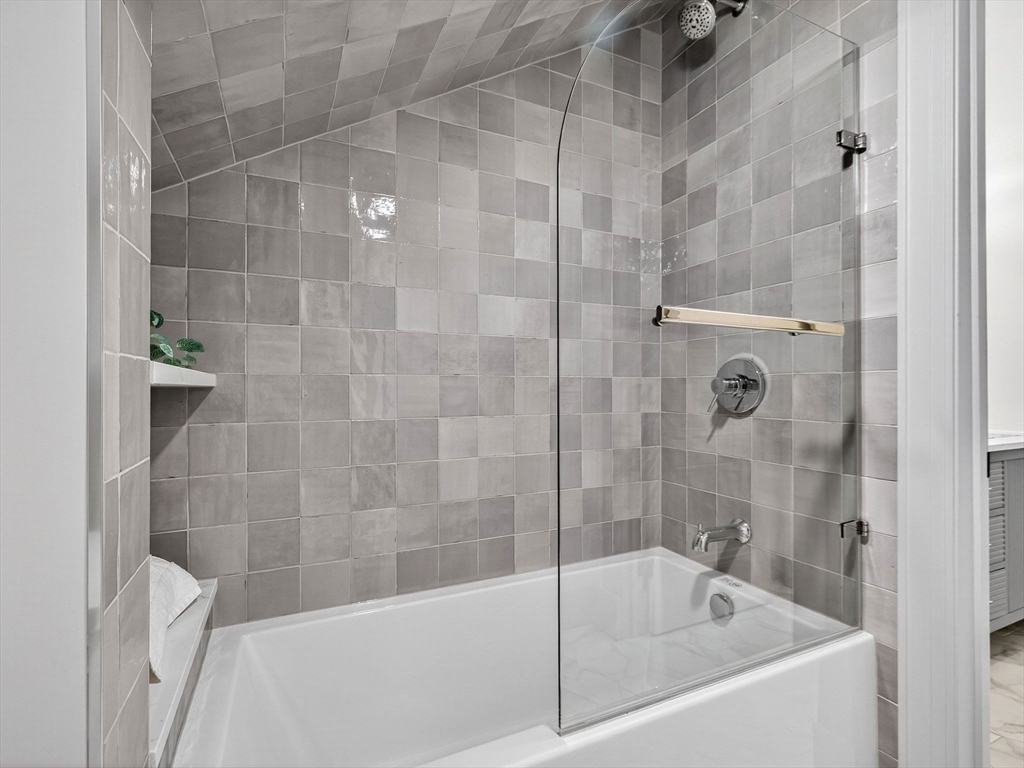 9 Norfolk Road Winchester, MA 01890 - Photo 34 of 42 a bathroom with a bathtub and shower