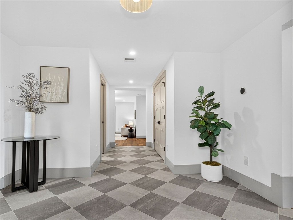 9 Norfolk Road Winchester, MA 01890 - Photo 7 of 42 a living room with furniture and a potted plant