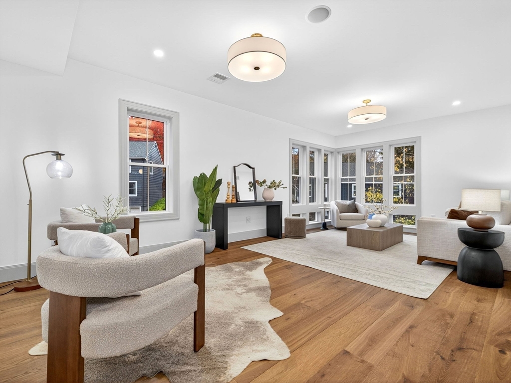 9 Norfolk Road Winchester, MA 01890 - Photo 8 of 42 a living room with furniture and a chandelier