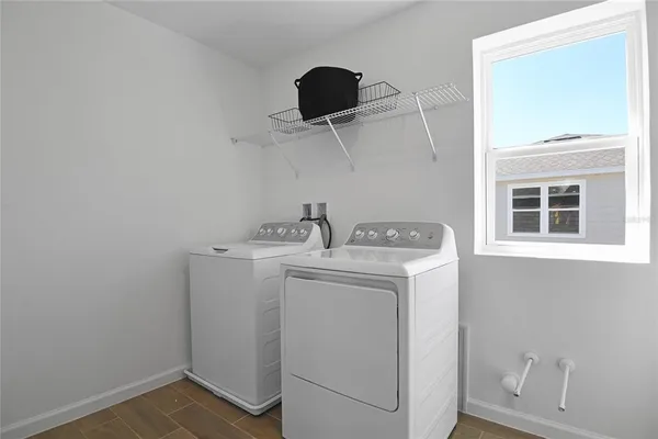 a utility room with dryer and washer