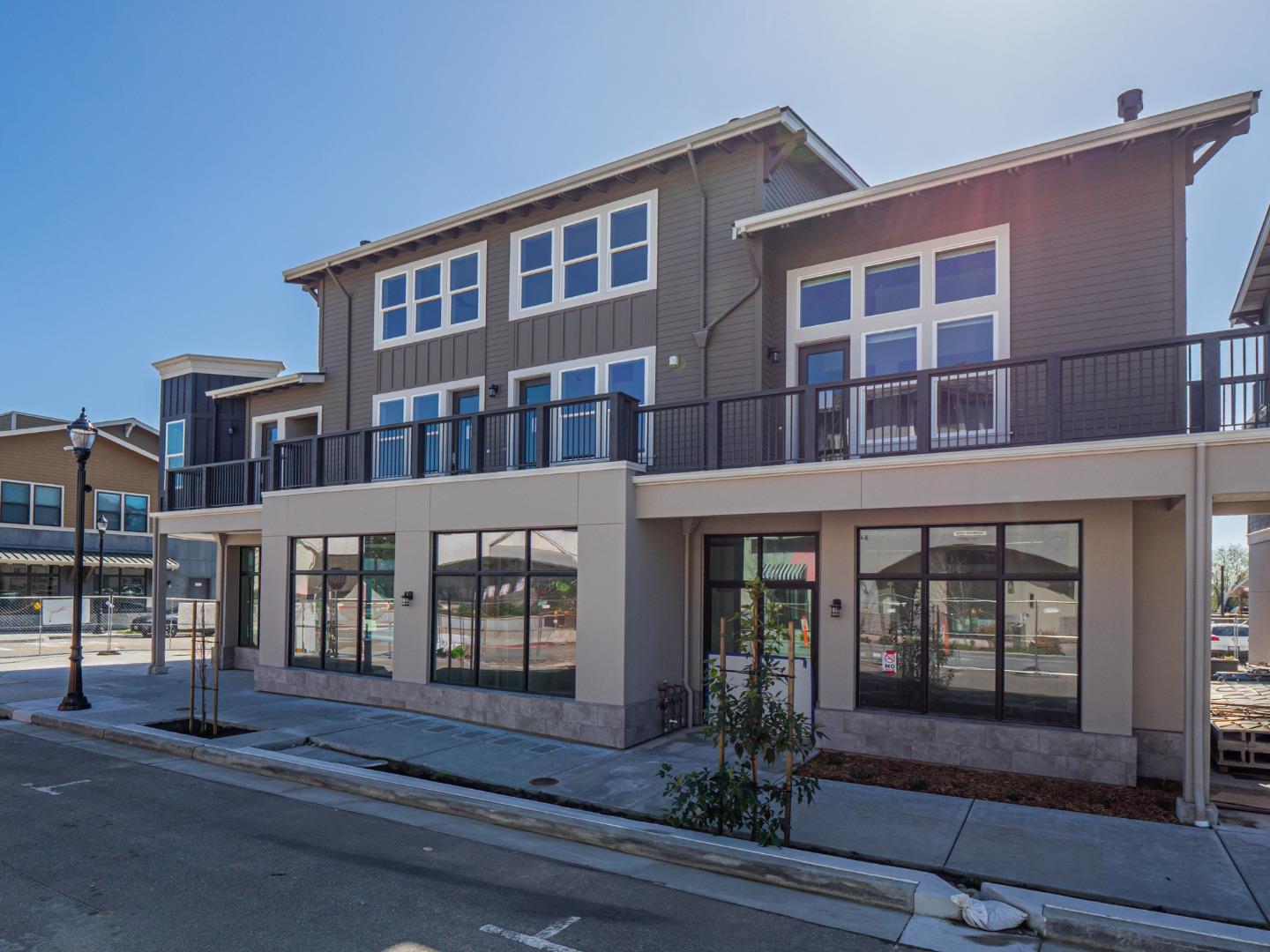 136 Aptos Vlg Way, Unit 2 Aptos, CA 95003 - Photo 1 of 1 a front view of a house with a yard
