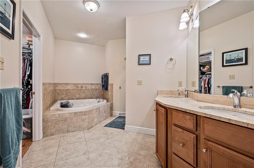 101 Quaker Ridge Court Beaver, PA 15009 - Photo 15 of 33 Primary bath features jetted tub, walk-in shower and spacious closet.