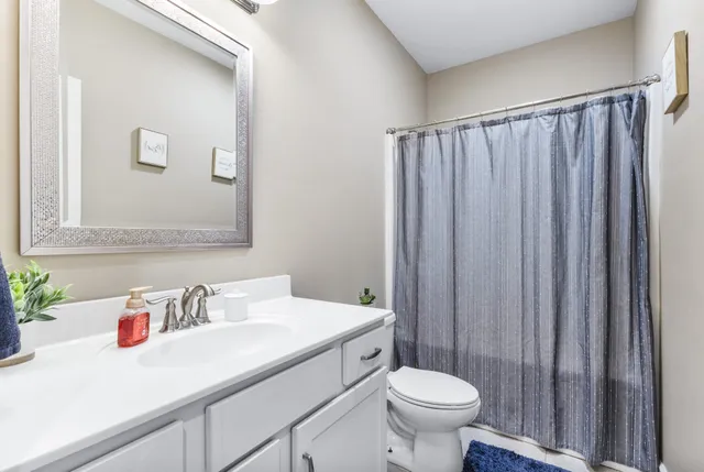 a view of a house with backyard and porch