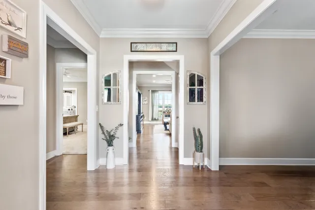 a dining room with furniture and wooden floor
