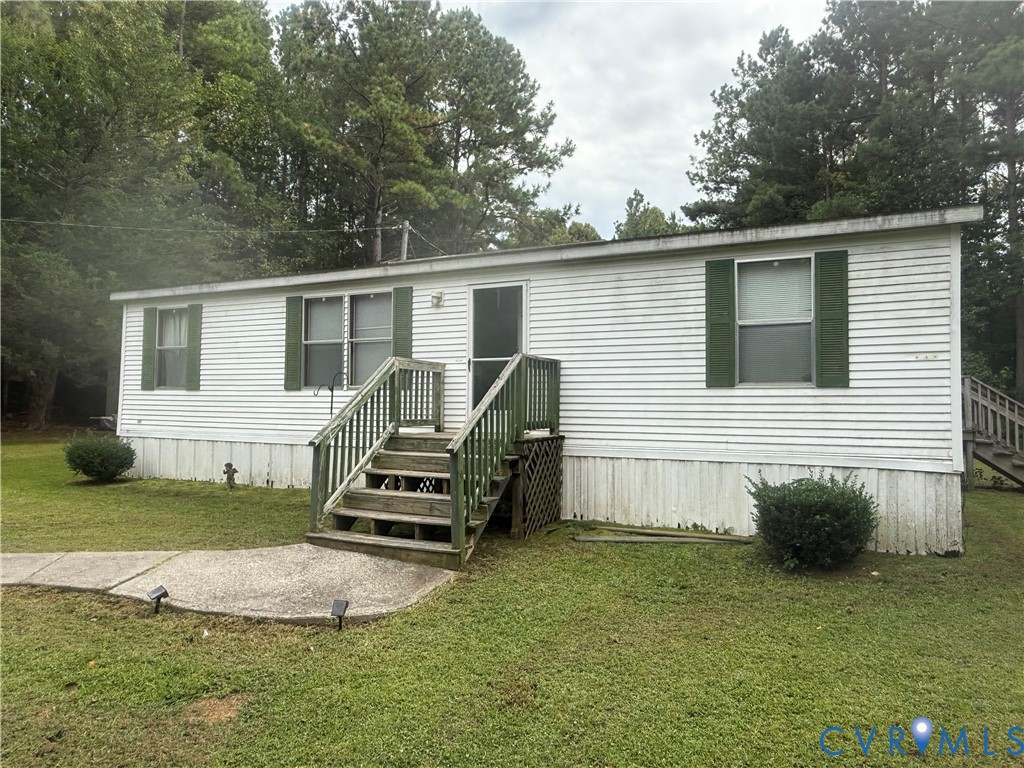 275 Doswell Road Blackstone, VA 23824 - Photo 2 of 9 a view of a house with a backyard