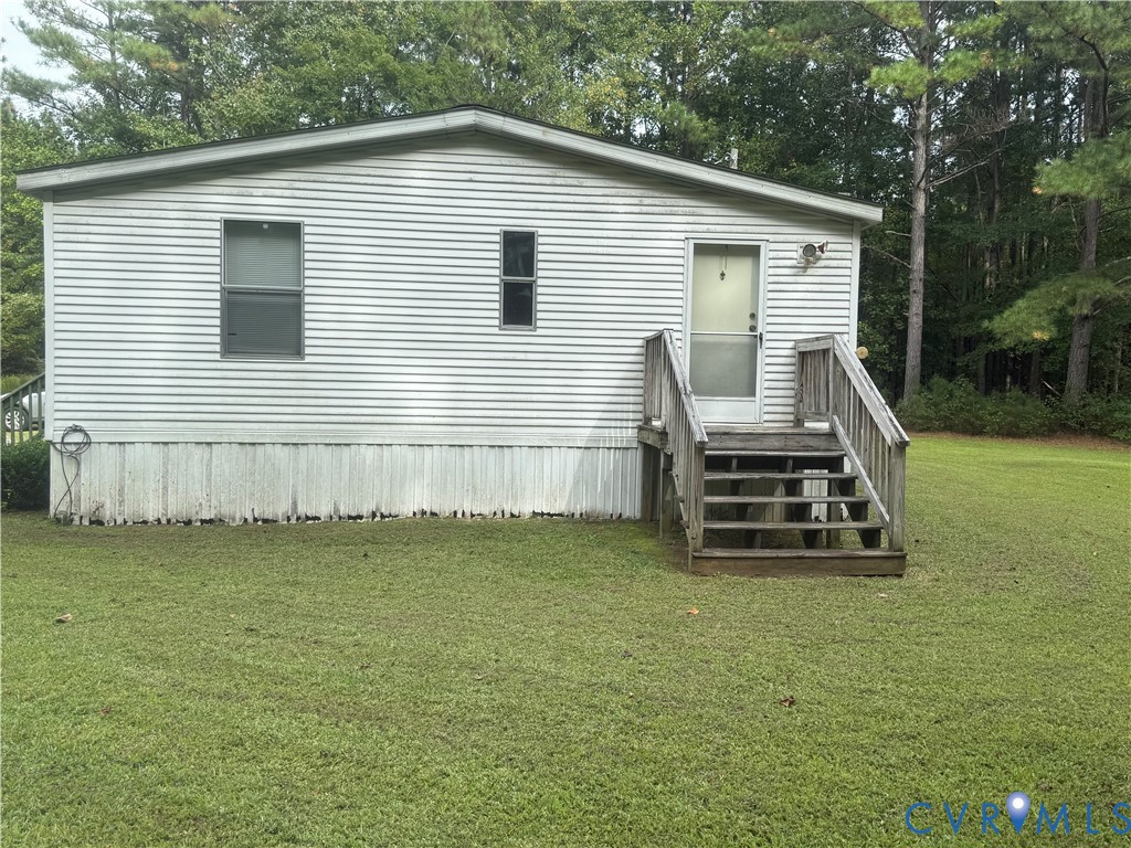 275 Doswell Road Blackstone, VA 23824 - Photo 4 of 9 a view of a house with a yard