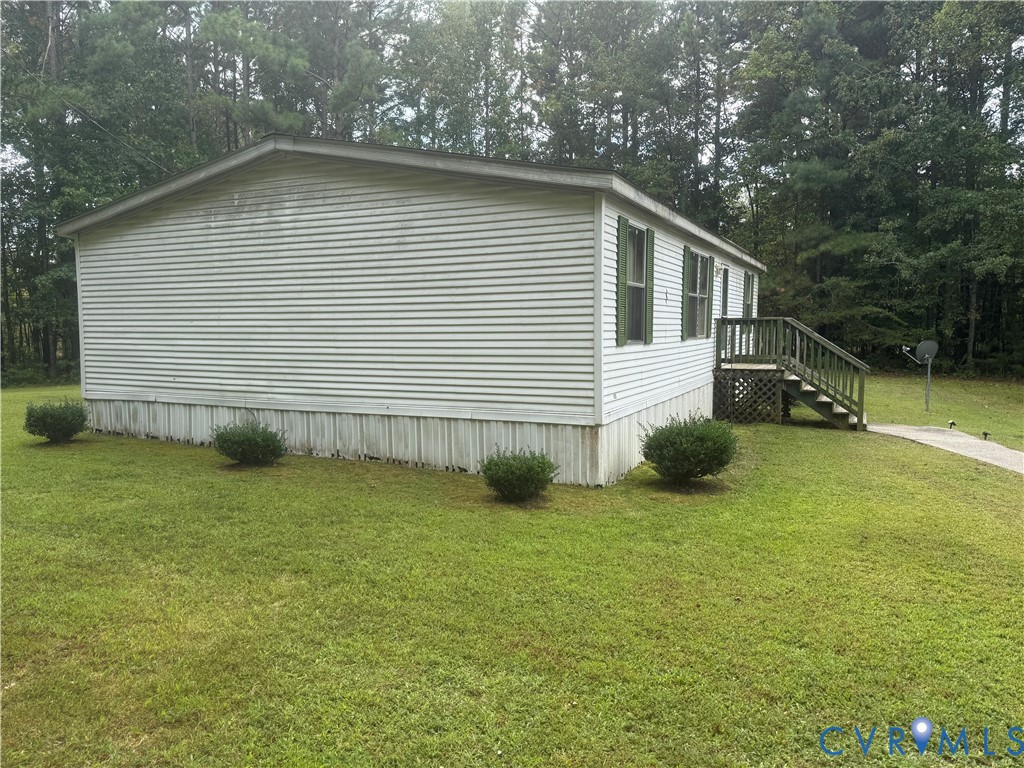 275 Doswell Road Blackstone, VA 23824 - Photo 5 of 9 a front view of a house with garden