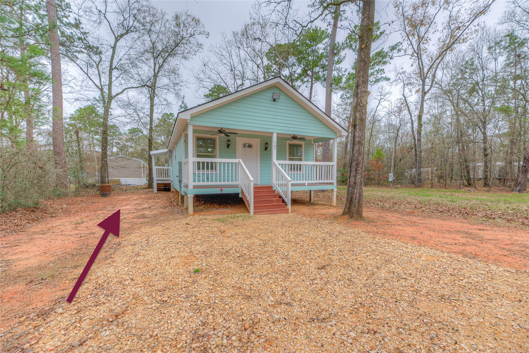 161 Evergreen Livingston, TX 77351 - Photo 2 of 34 There is a PVC septic pipe for an RV to hook into the main house.