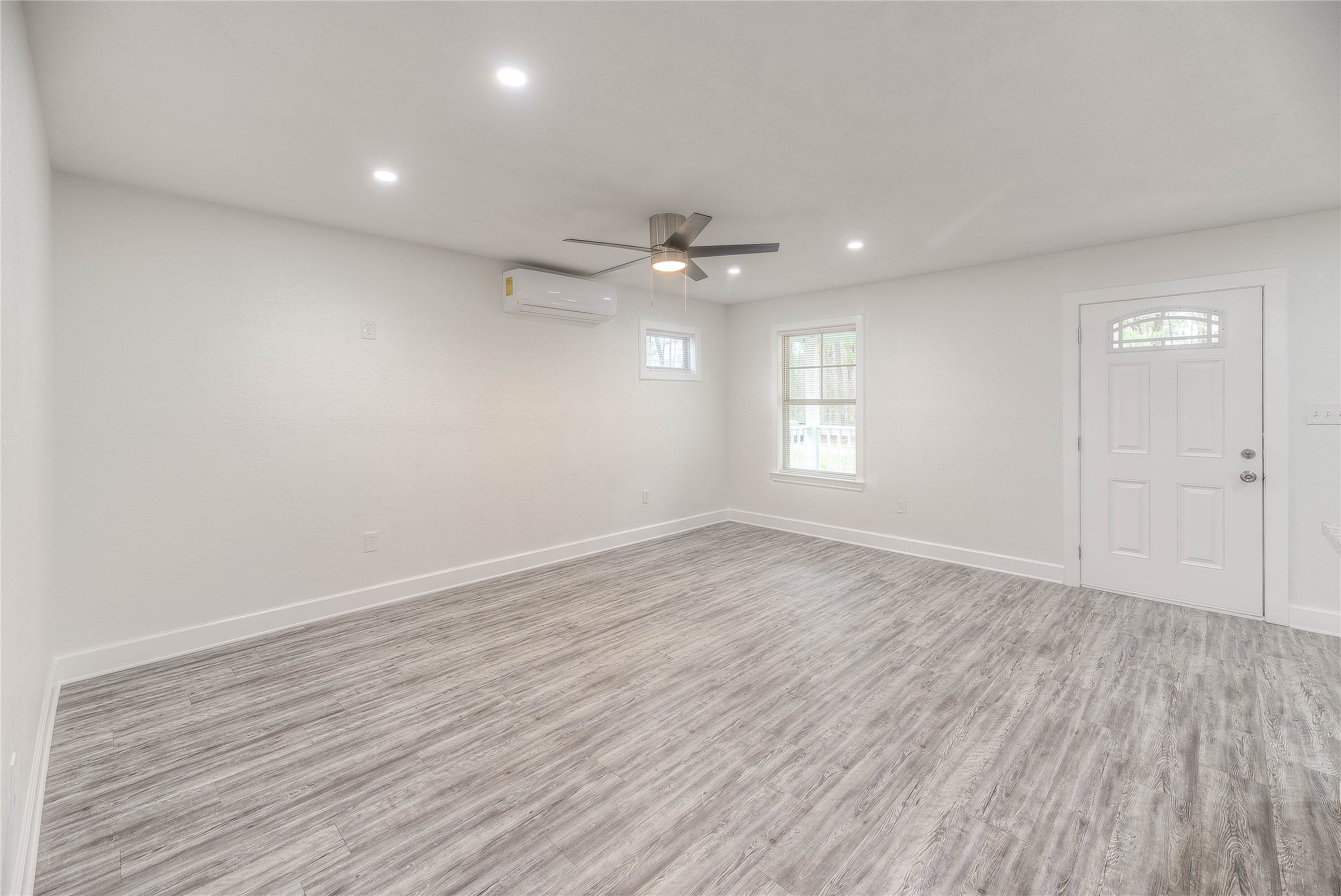 161 Evergreen Livingston, TX 77351 - Photo 9 of 34 Living room with vinyl flooring throughout the house.