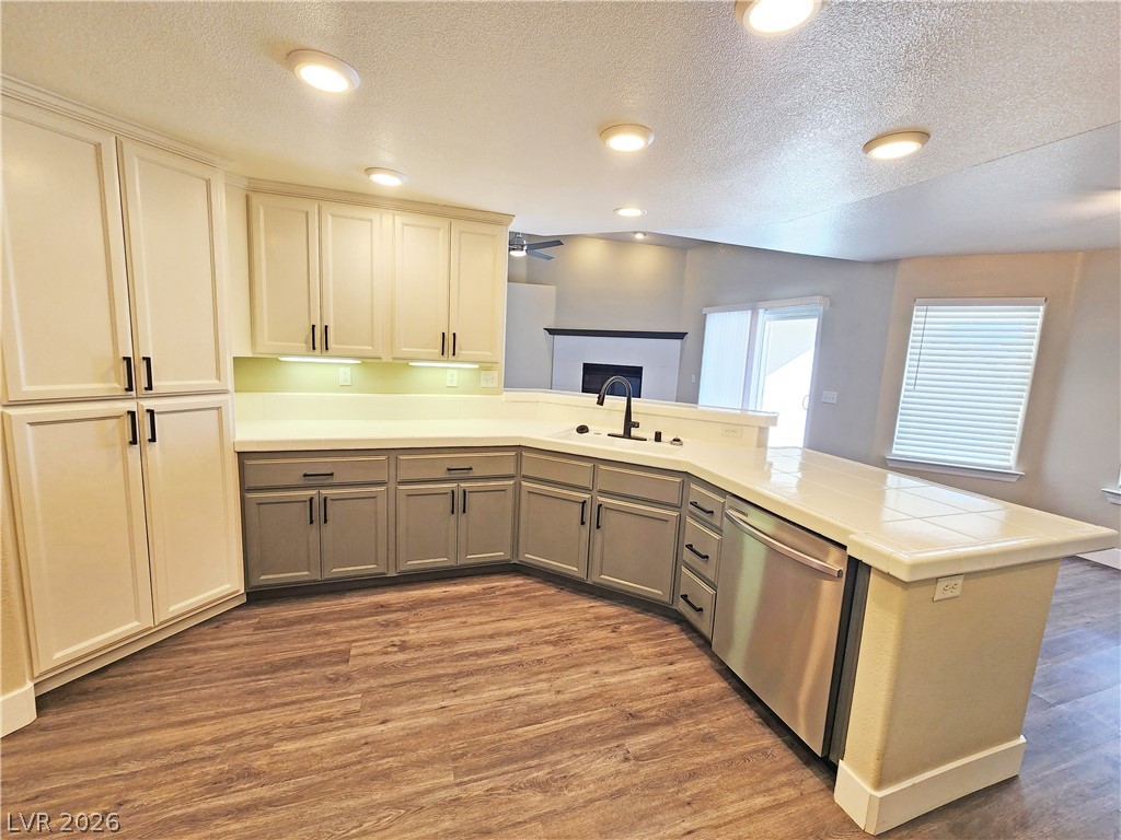 4591 Stoneham Street Pahrump, NV 89061 - Photo 16 of 42 An inviting kitchen features a spacious island and lustrous wood-grain flooring.