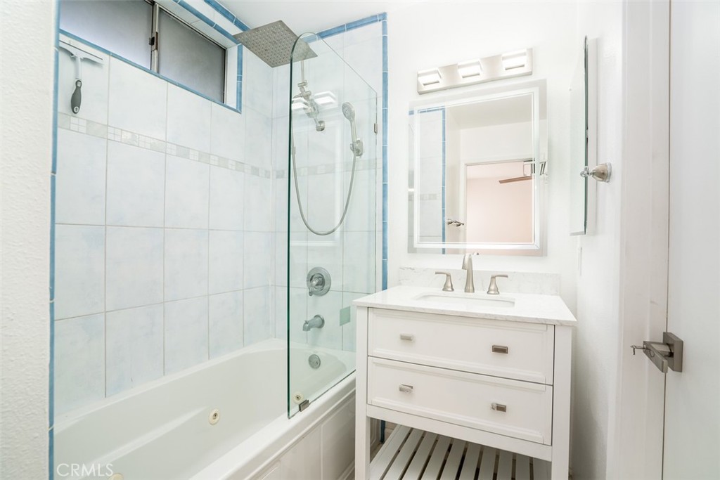 16734 Algonquin Street, Unit 6 Huntington Beach, CA 92649 - Photo 14 of 27 a bathroom with a sink a toilet and shower