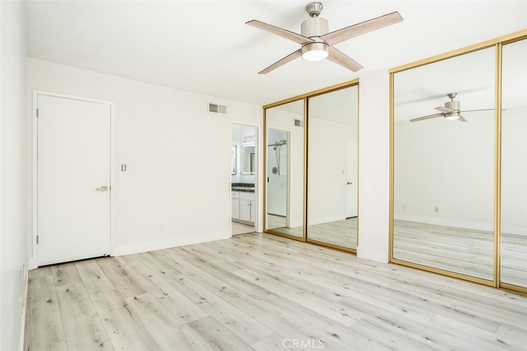16734 Algonquin Street, Unit 6 Huntington Beach, CA 92649 - Photo 18 of 27 wooden floor in an empty room