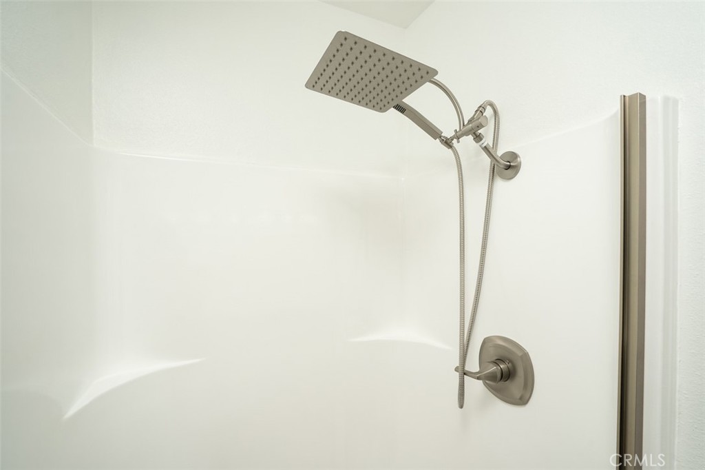 16734 Algonquin Street, Unit 6 Huntington Beach, CA 92649 - Photo 20 of 27 a bathroom with a shower