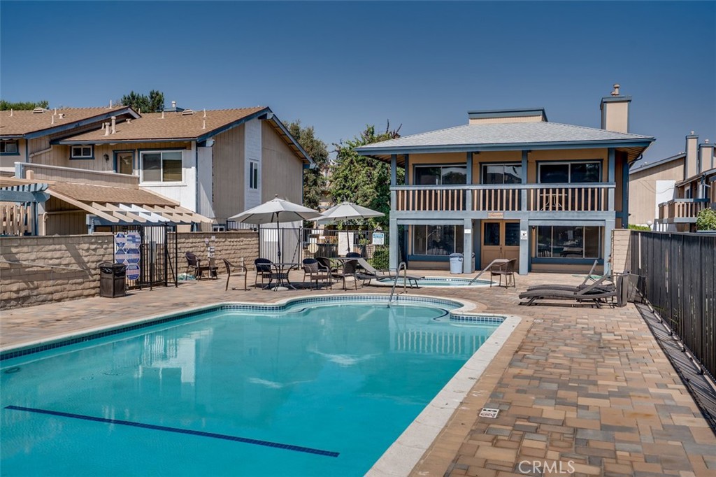 16734 Algonquin Street, Unit 6 Huntington Beach, CA 92649 - Photo 26 of 27 a view of house with swimming pool and furniture