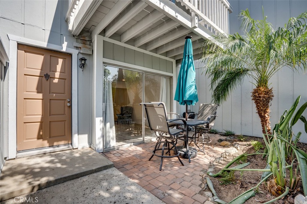 16734 Algonquin Street, Unit 6 Huntington Beach, CA 92649 - Photo 3 of 27 a view of outdoor space yard and porch