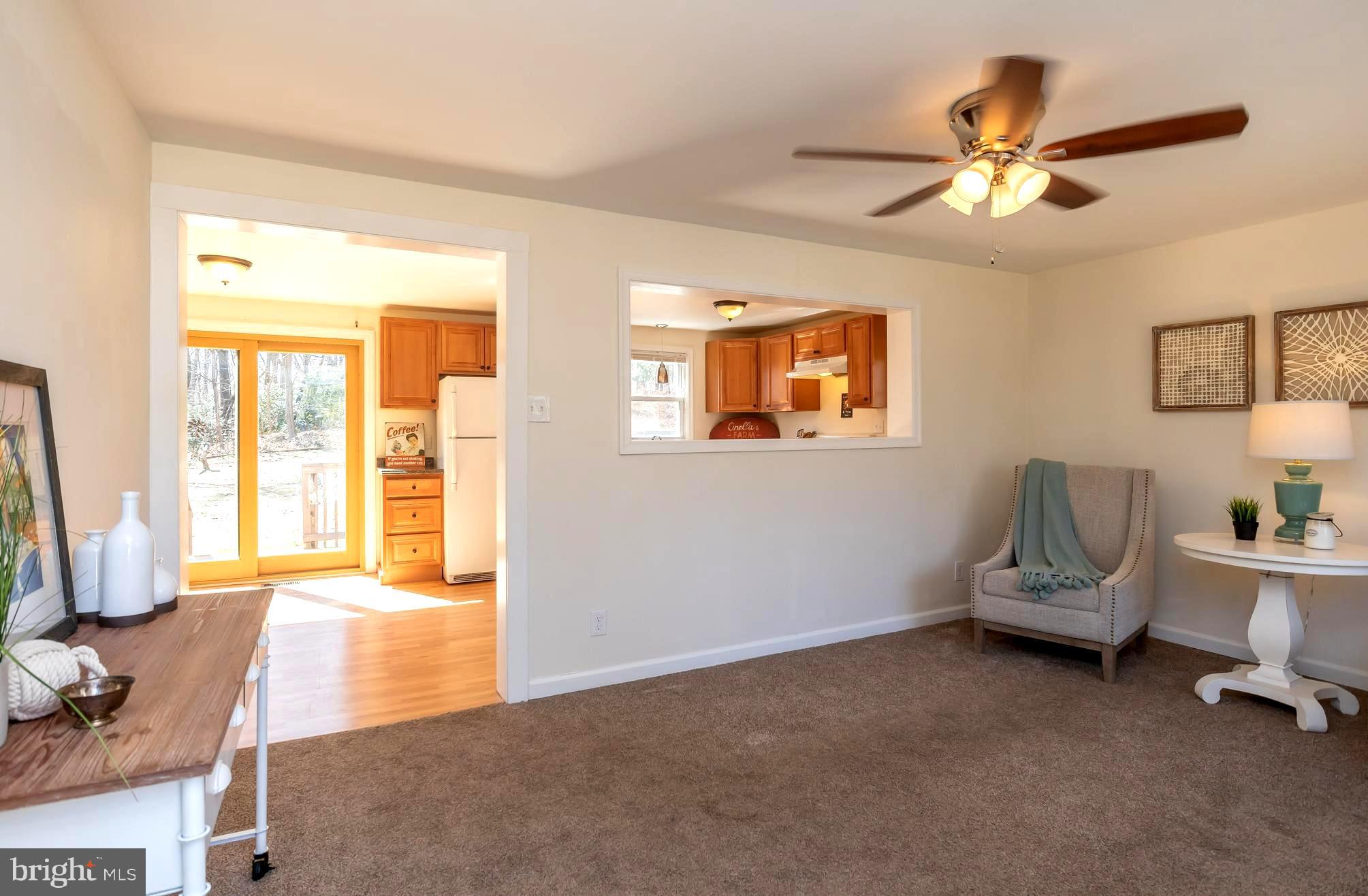 949 Hilltop Road Arnold, MD 21012 - Photo 6 of 42 Light-Filled Interiors with Ceiling Fan Breezes