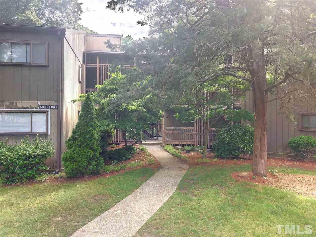 5086 Flint Ridge Place, Unit 5086 Raleigh, NC 27609 - Photo 1 of 8 a view of a back yard