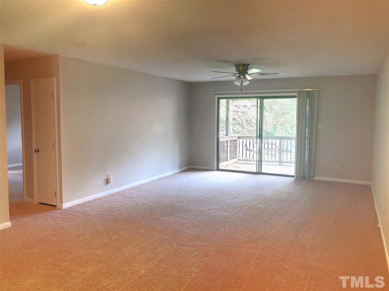 5086 Flint Ridge Place, Unit 5086 Raleigh, NC 27609 - Photo 3 of 8 a view of an empty room with a window