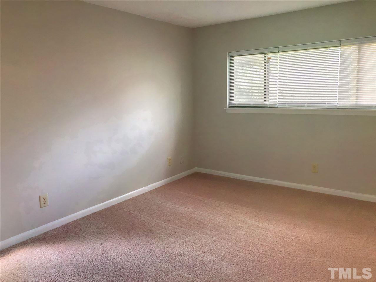 5086 Flint Ridge Place, Unit 5086 Raleigh, NC 27609 - Photo 5 of 8 an empty room with a window