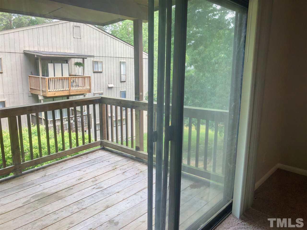 5086 Flint Ridge Place, Unit 5086 Raleigh, NC 27609 - Photo 8 of 8 a view of a balcony with wooden floor