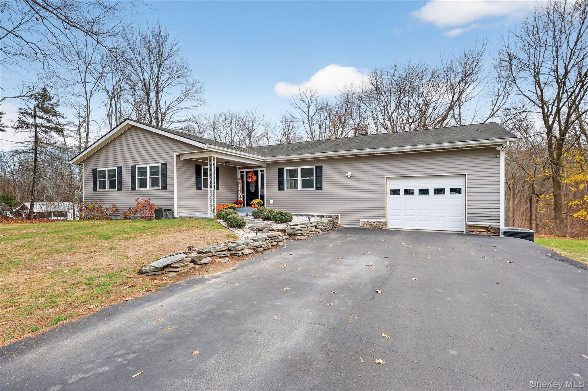 8 Ridge Road Wallkill, NY 12589 - Photo 3 of 48 a view of a house with snow on the side of the road