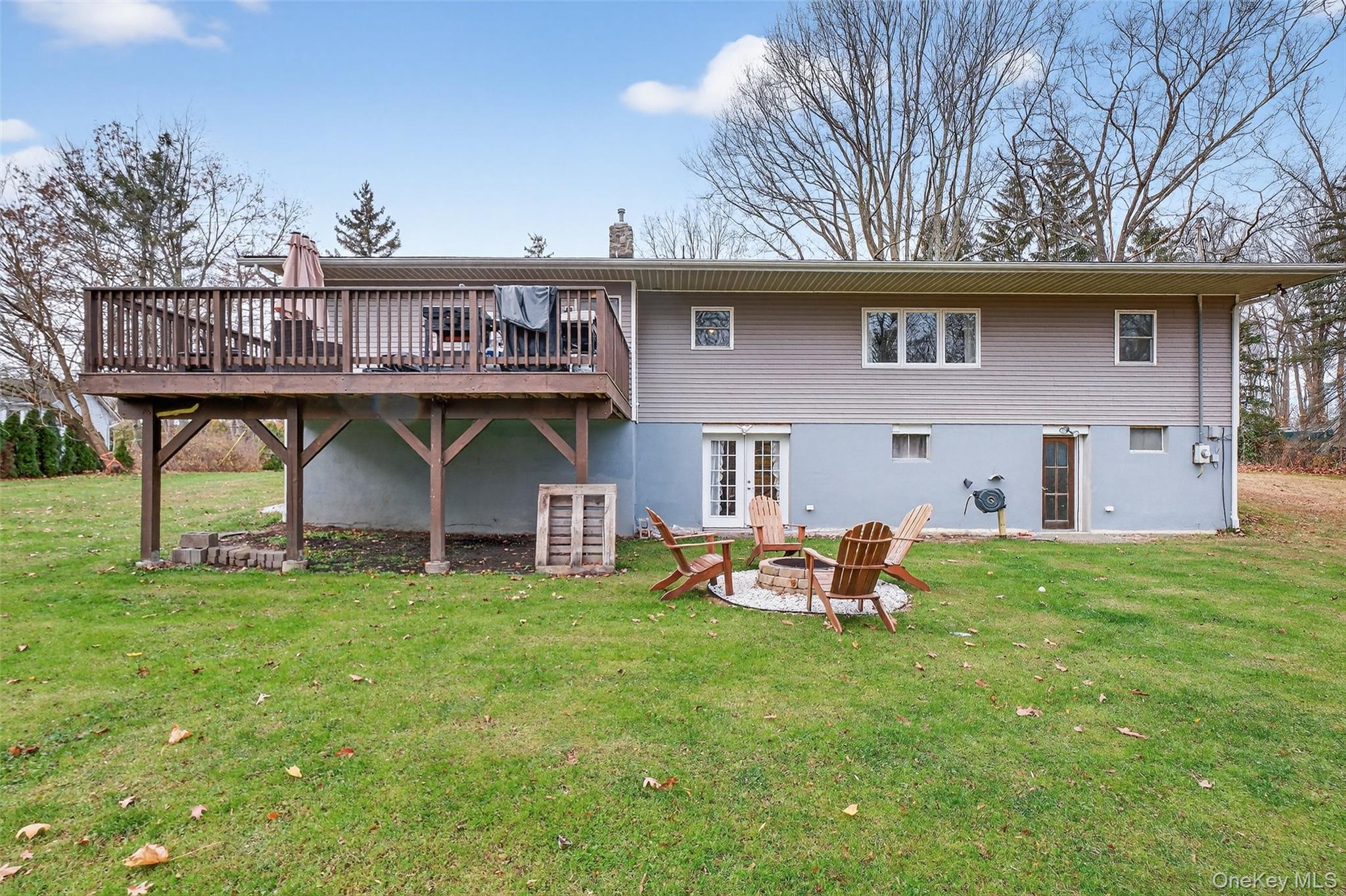 8 Ridge Road Wallkill, NY 12589 - Photo 47 of 48 a view of a house with a backyard and a patio