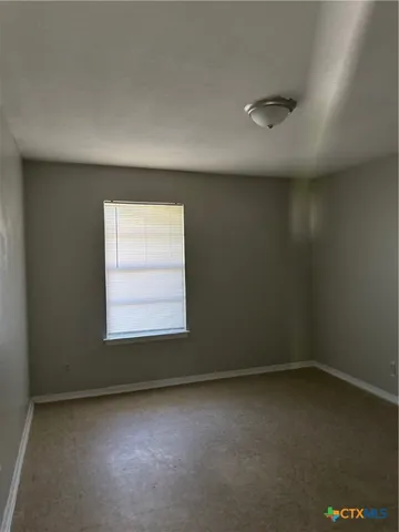 a bathroom with a granite countertop toilet and a shower