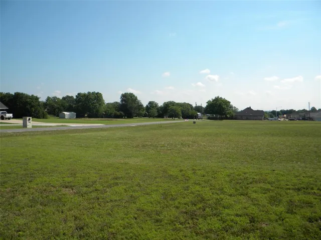 a view of a lake with a big yard
