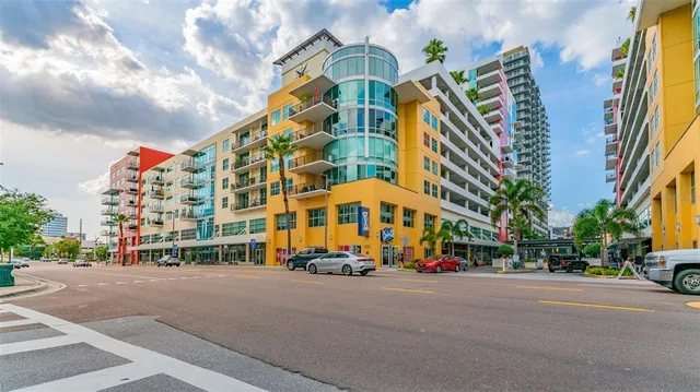 a city street lined with buildings and cars