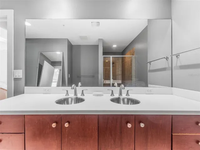a bathroom with a sink and a mirror