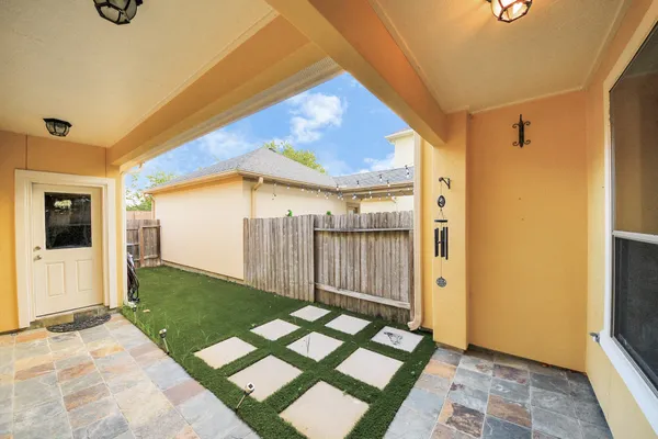 a view of a porch with a backyard