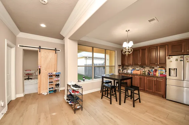 a view of a dining room with furniture window and outside view