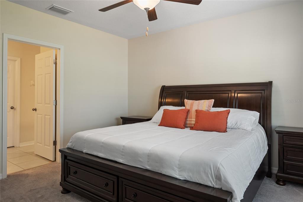 19041 Alfaro Loop Spring Hill, FL 34610 - Photo 11 of 39 a bedroom with a bed and window