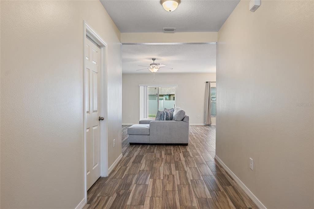 19041 Alfaro Loop Spring Hill, FL 34610 - Photo 19 of 39 a very nice looking room with wooden floor