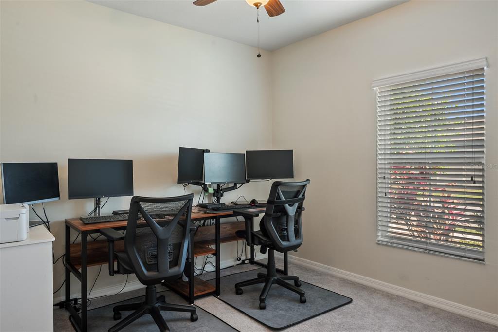 19041 Alfaro Loop Spring Hill, FL 34610 - Photo 20 of 39 a view of a workspace with furniture and a window