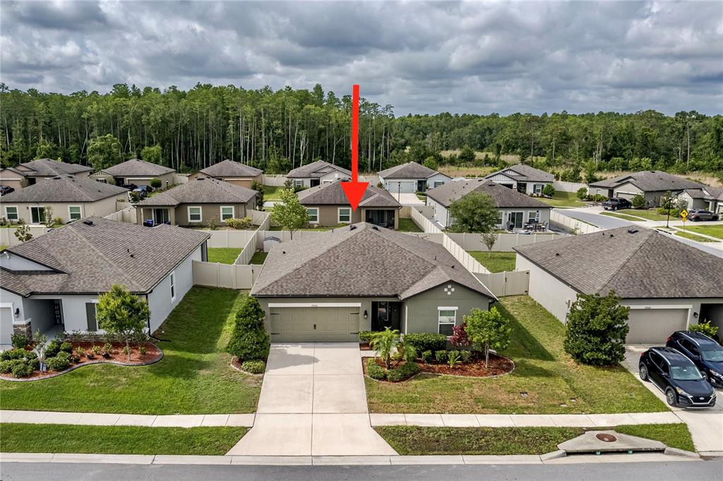 19041 Alfaro Loop Spring Hill, FL 34610 - Photo 22 of 39 a view of multiple houses with yard