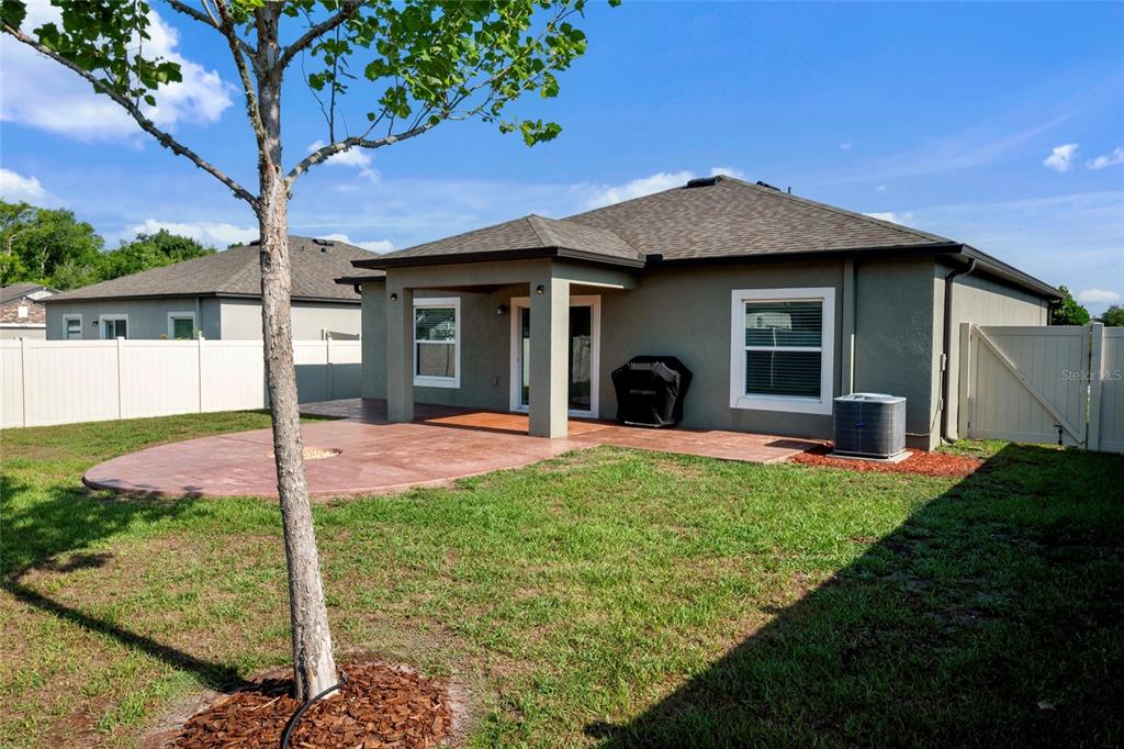 19041 Alfaro Loop Spring Hill, FL 34610 - Photo 24 of 39 a front view of a house with a yard and porch